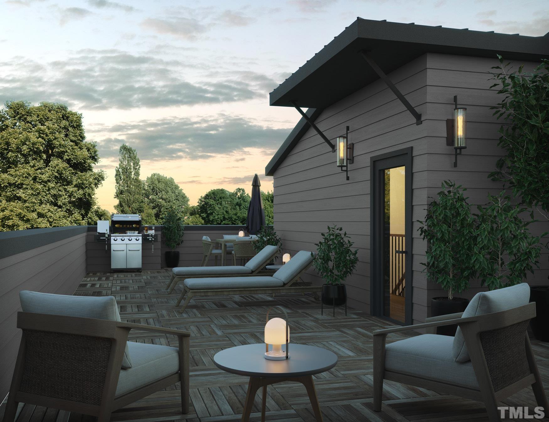 613 South West Street Raleigh, NC 27601 - Photo 2 of 18 a roof deck with table and chairs a barbeque