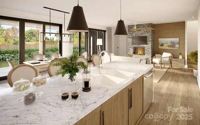 a kitchen with a sink a counter and dining table