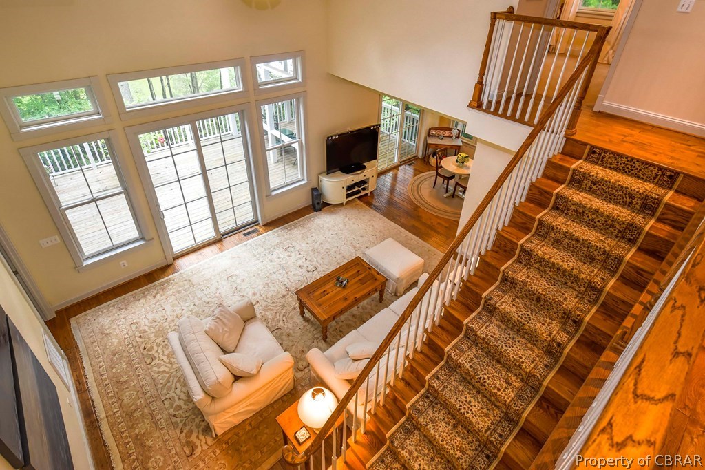 137 Mastons Wharf Road Lancaster, VA 22503 - Photo 22 of 39 a view of a living room with a rug floor and a large window