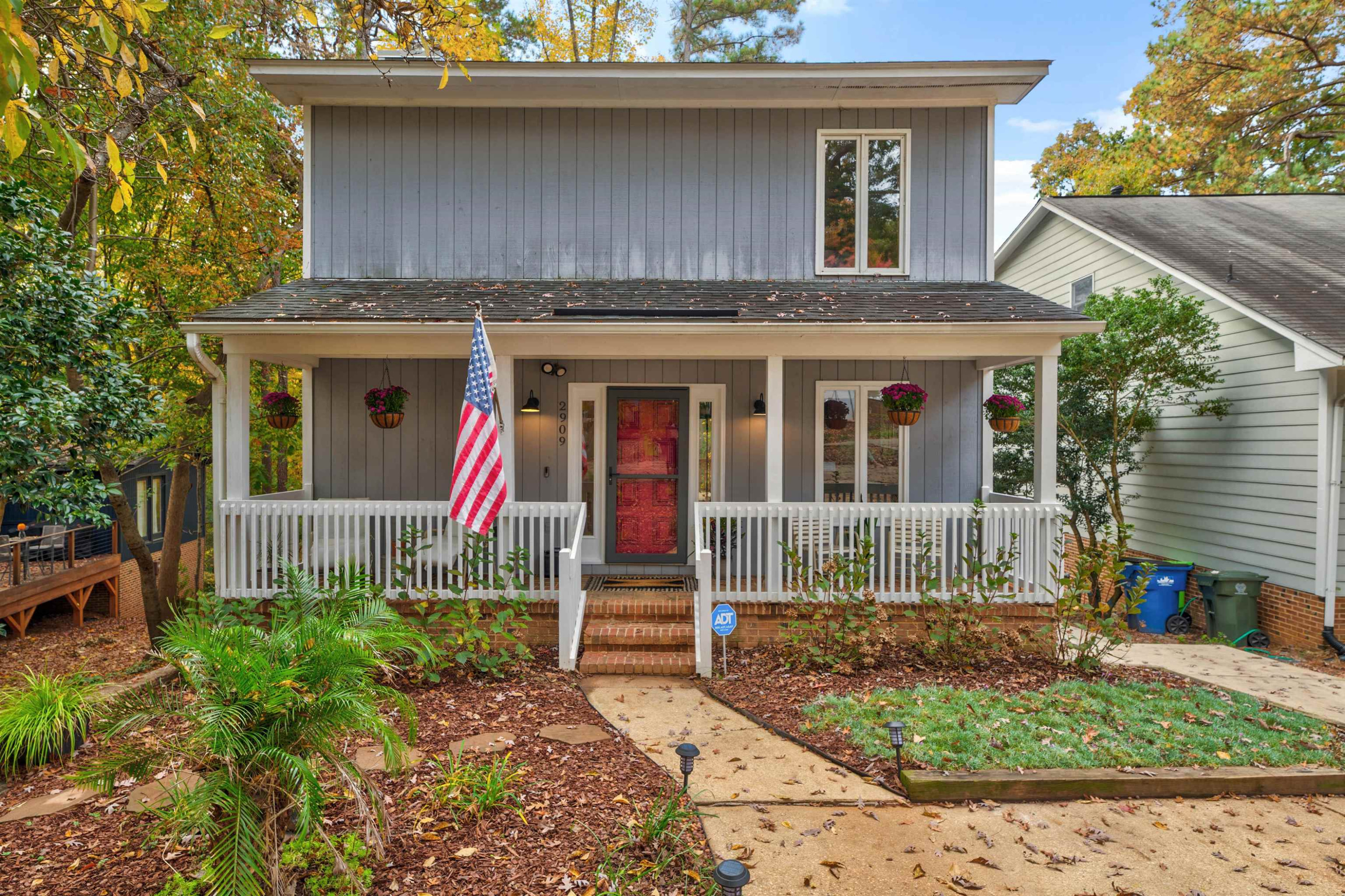 2909 Rue Sans Famille Raleigh, NC 27607 - Photo 1 of 35 a front view of a house with garden