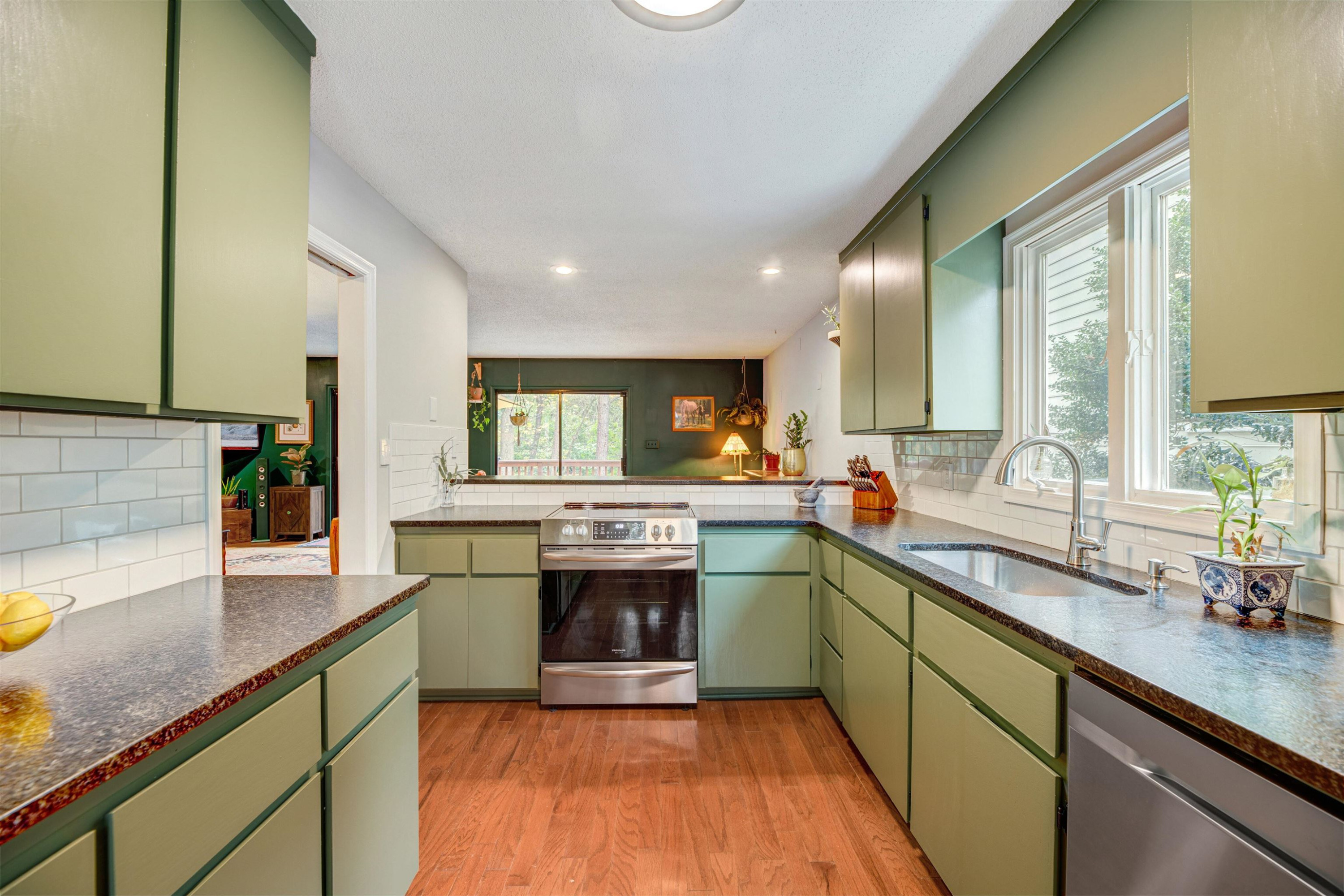 2909 Rue Sans Famille Raleigh, NC 27607 - Photo 13 of 35 a kitchen with sink stove and refrigerator