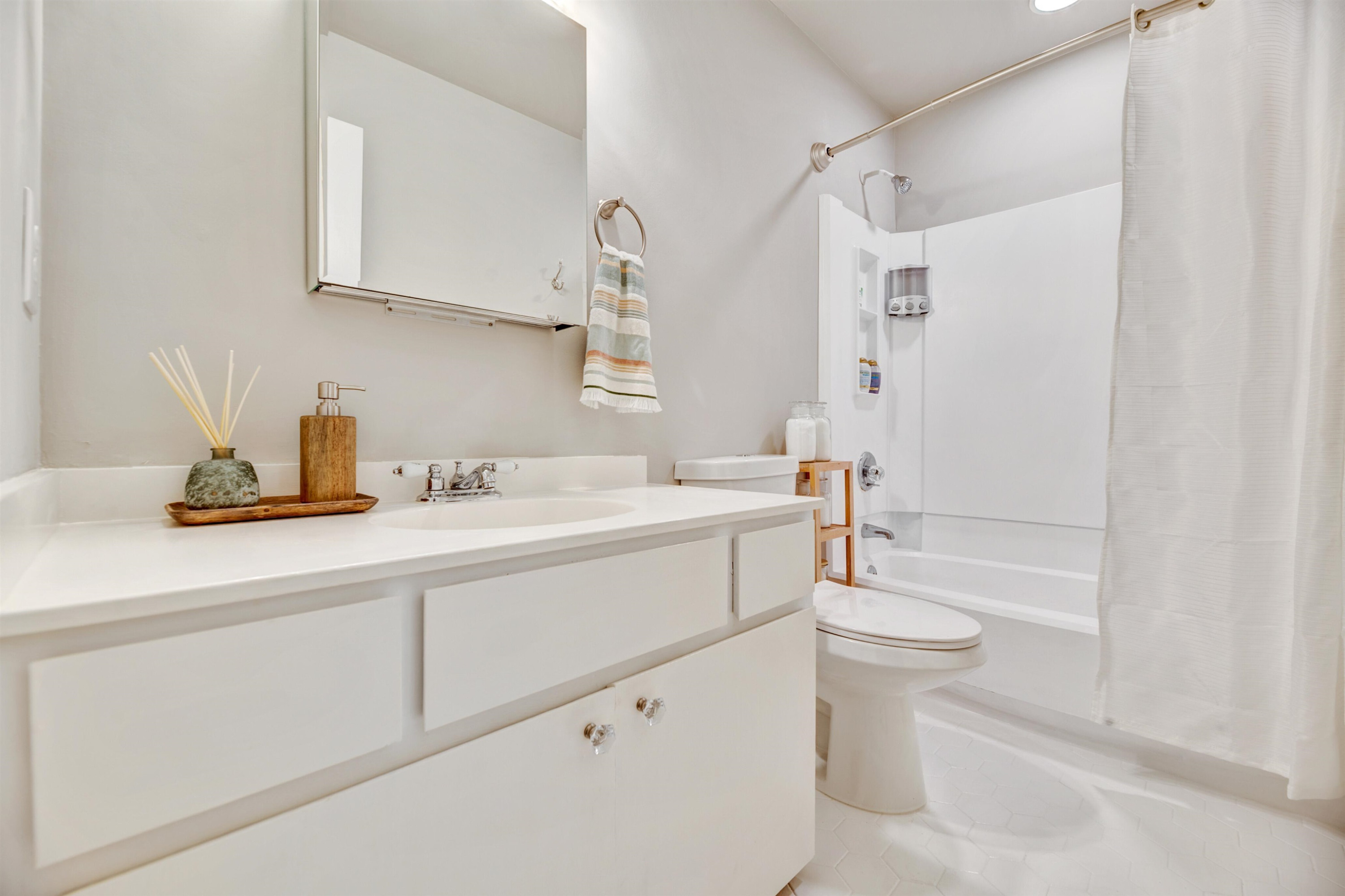 2909 Rue Sans Famille Raleigh, NC 27607 - Photo 19 of 35 a bathroom with a sink a toilet and shower