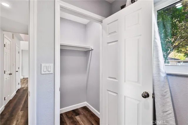 a view of a hallway with a small yard