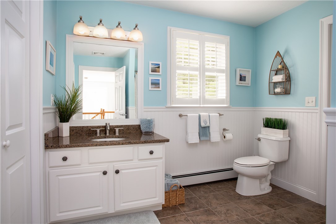 9 Cedar Meadows Road Charlestown, RI 02813 - Photo 27 of 39 2nd floor main bath has tile floor, granite, wainscoting and conveniently located laundry.
