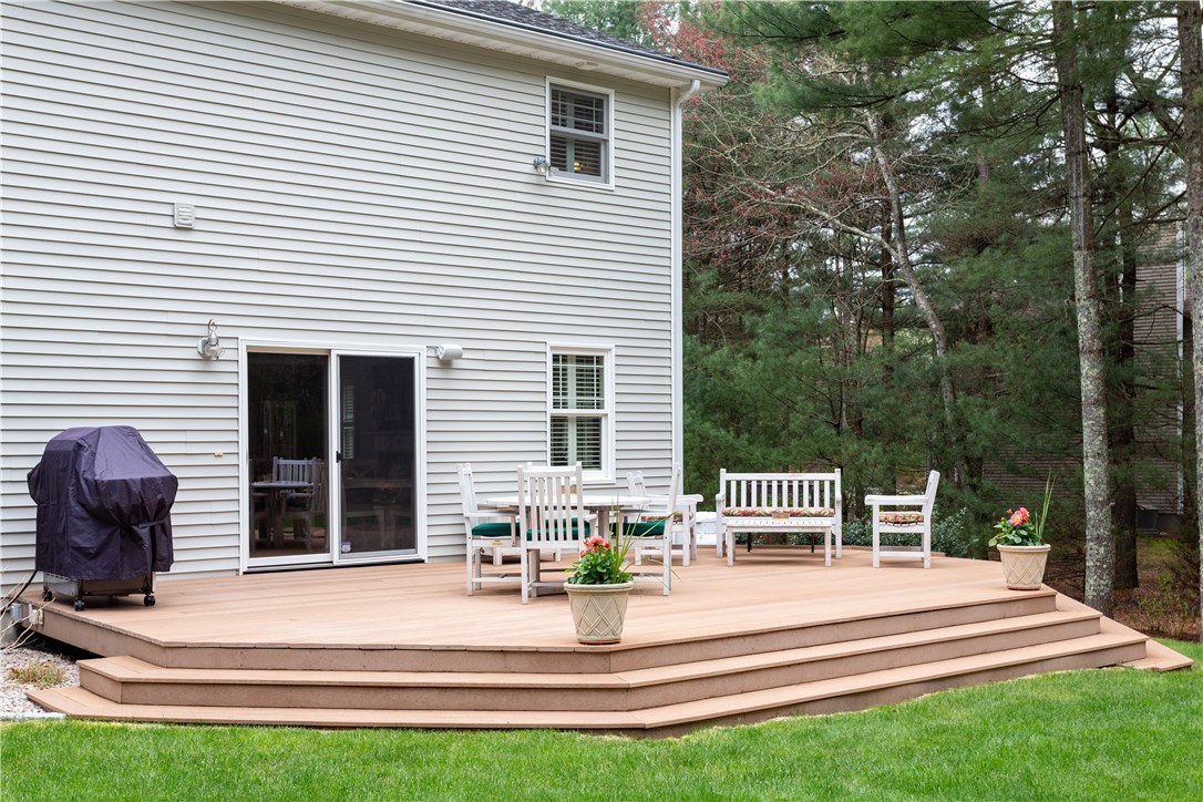 9 Cedar Meadows Road Charlestown, RI 02813 - Photo 30 of 39 Fabulous backyard with over sized deck, outdoor speakers and easy gas connection for the grill. Great for entertaining family and friends!