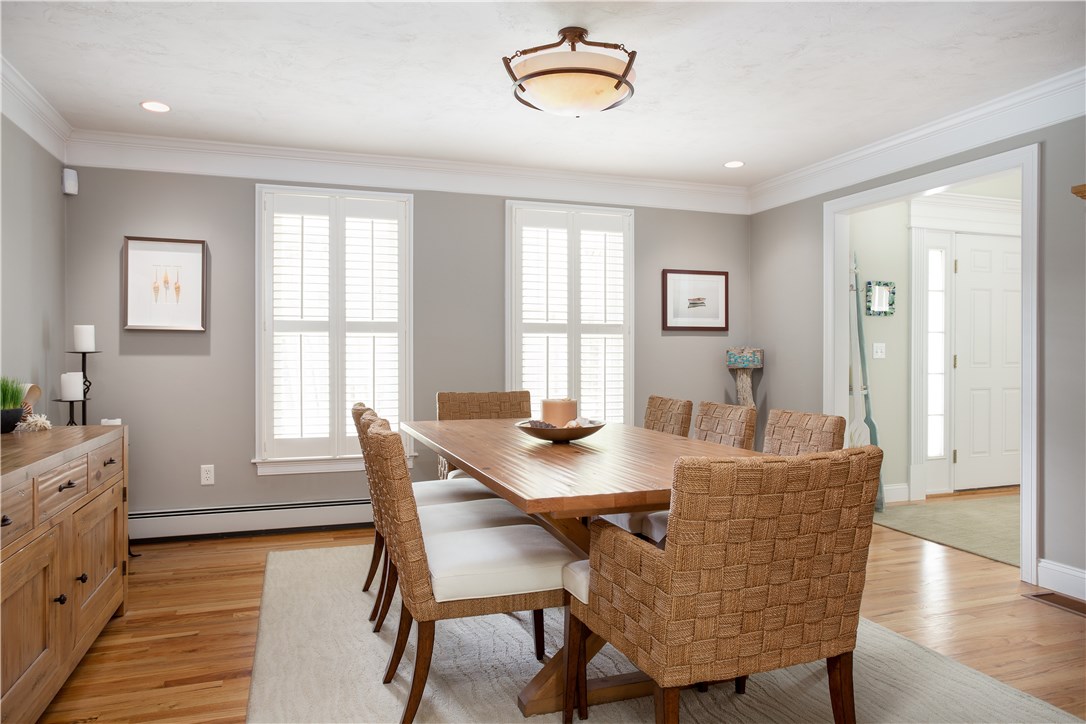 9 Cedar Meadows Road Charlestown, RI 02813 - Photo 6 of 39 Spacious formal dining room, with hardwood floors and coastal shutters.