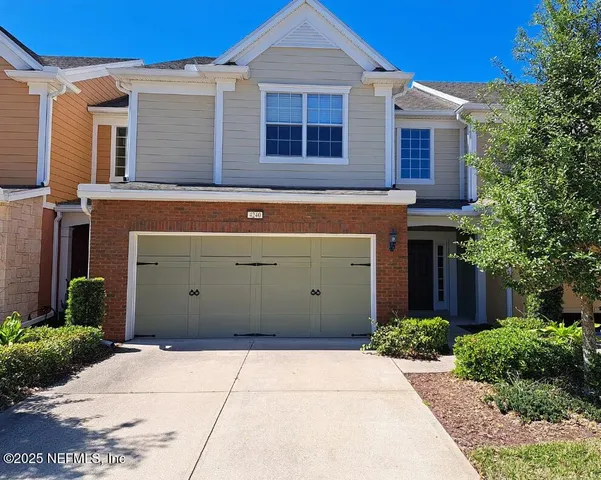 a living room with a black white checkered floor