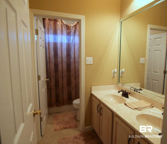 7263 Highpointe Place East Daphne, AL 36527 - Photo 20 of 22 Bathroom offers double vanity and a private shower area for convenience!