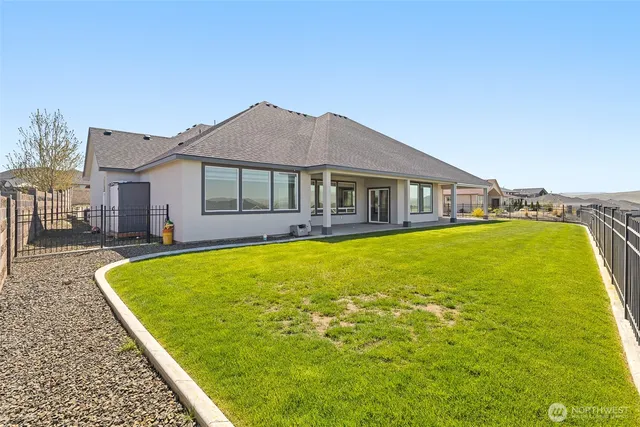 a front view of a house with a yard and porch