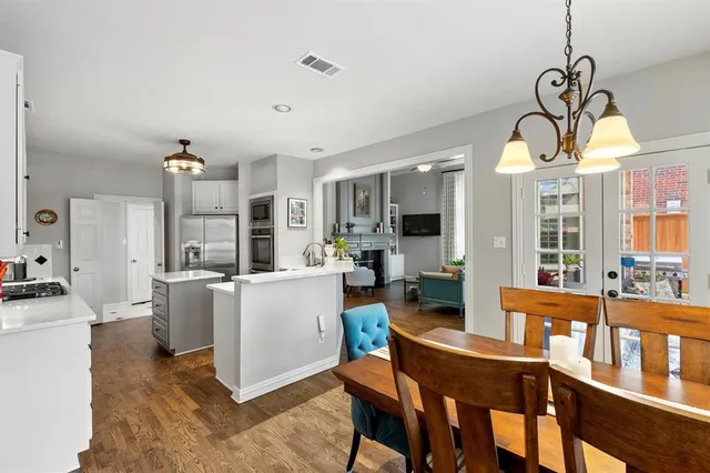 a living room with furniture a dining table and chairs