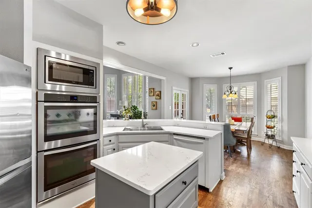 a kitchen with a stove and a microwave