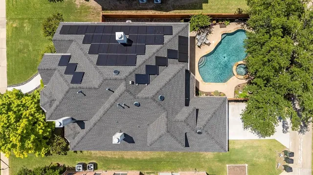 an aerial view of residential houses with outdoor space