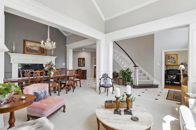 a living room with furniture and a large mirror