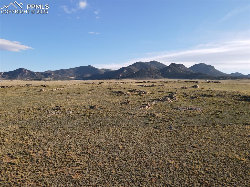 a view of an ocean and a mountain