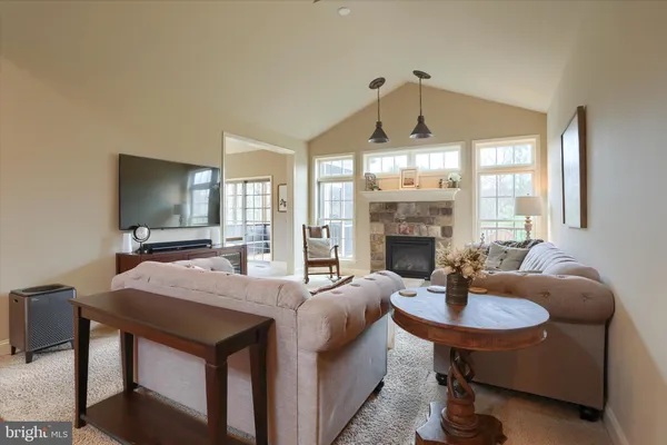 a kitchen with stainless steel appliances granite countertop a refrigerator sink and stove