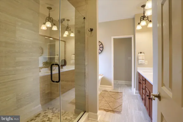 a en suite bathroom with a sink and a mirror