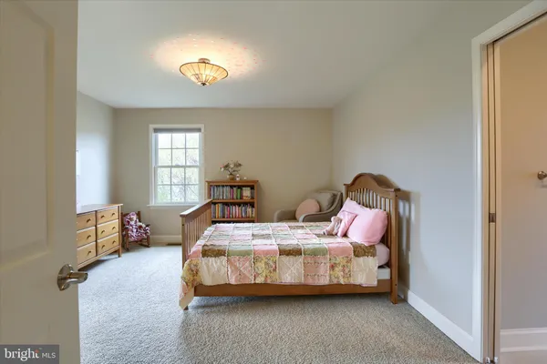 a room with furniture and a large window
