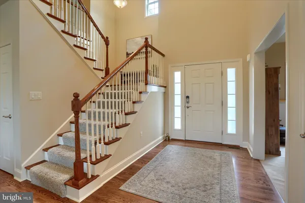 a view of a workspace with furniture and staircase