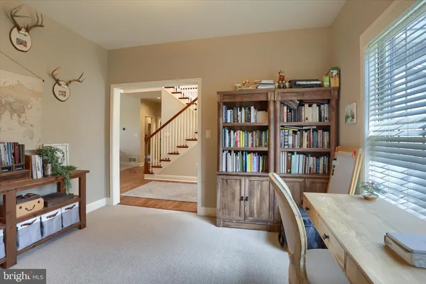 a open kitchen with stainless steel appliances granite countertop a stove top oven a sink and a refrigerator