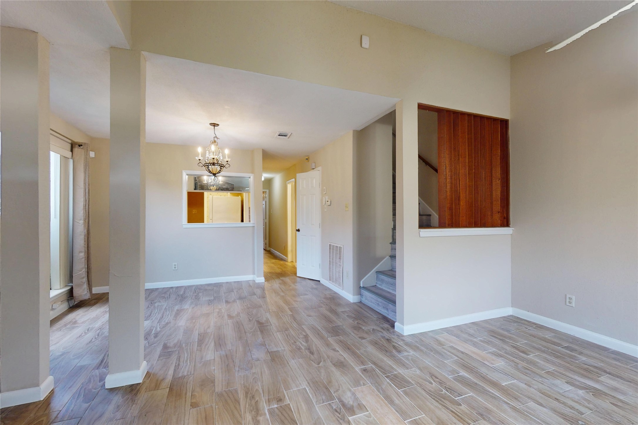 7840 Bateman Lane Houston, TX 77088 - Photo 11 of 25 wooden floor in an empty room with a window