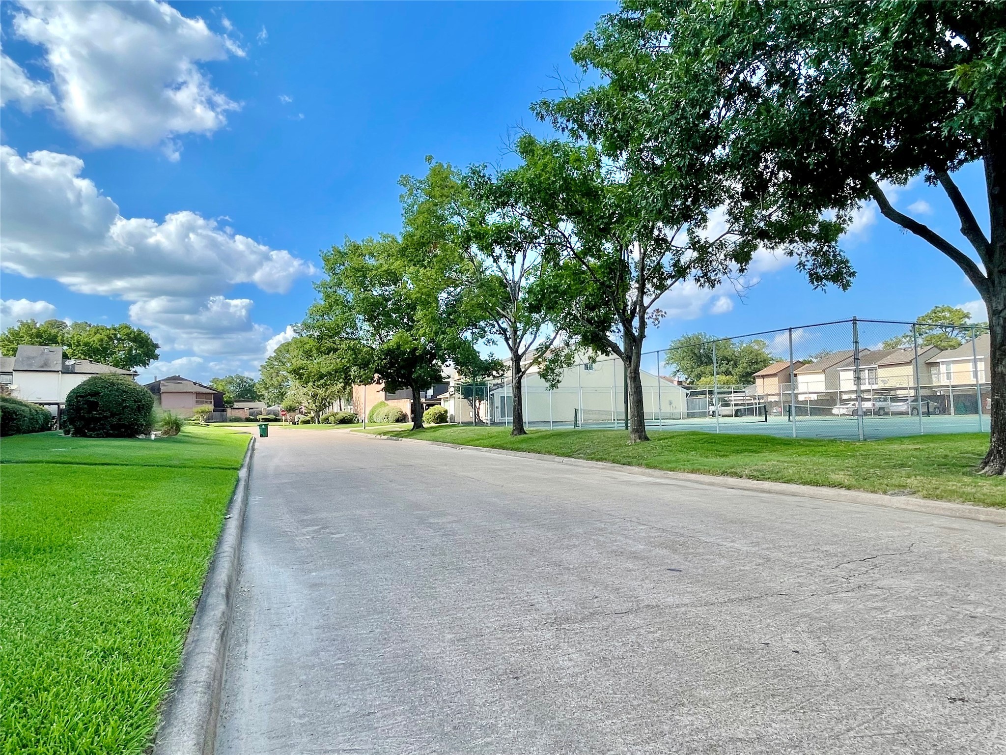 7840 Bateman Lane Houston, TX 77088 - Photo 17 of 25 a view of a house with a big yard and large trees