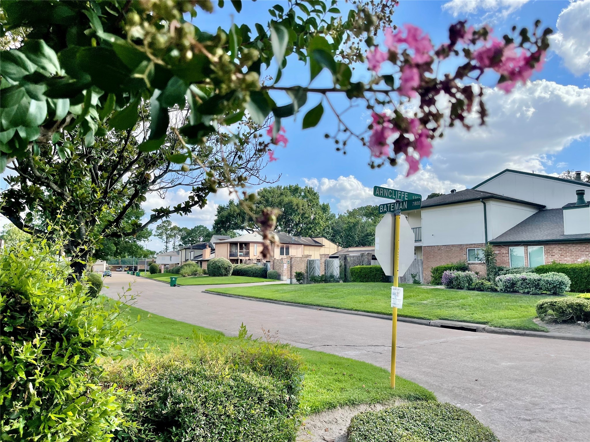 7840 Bateman Lane Houston, TX 77088 - Photo 23 of 25 a front view of a house with a big yard and potted plants