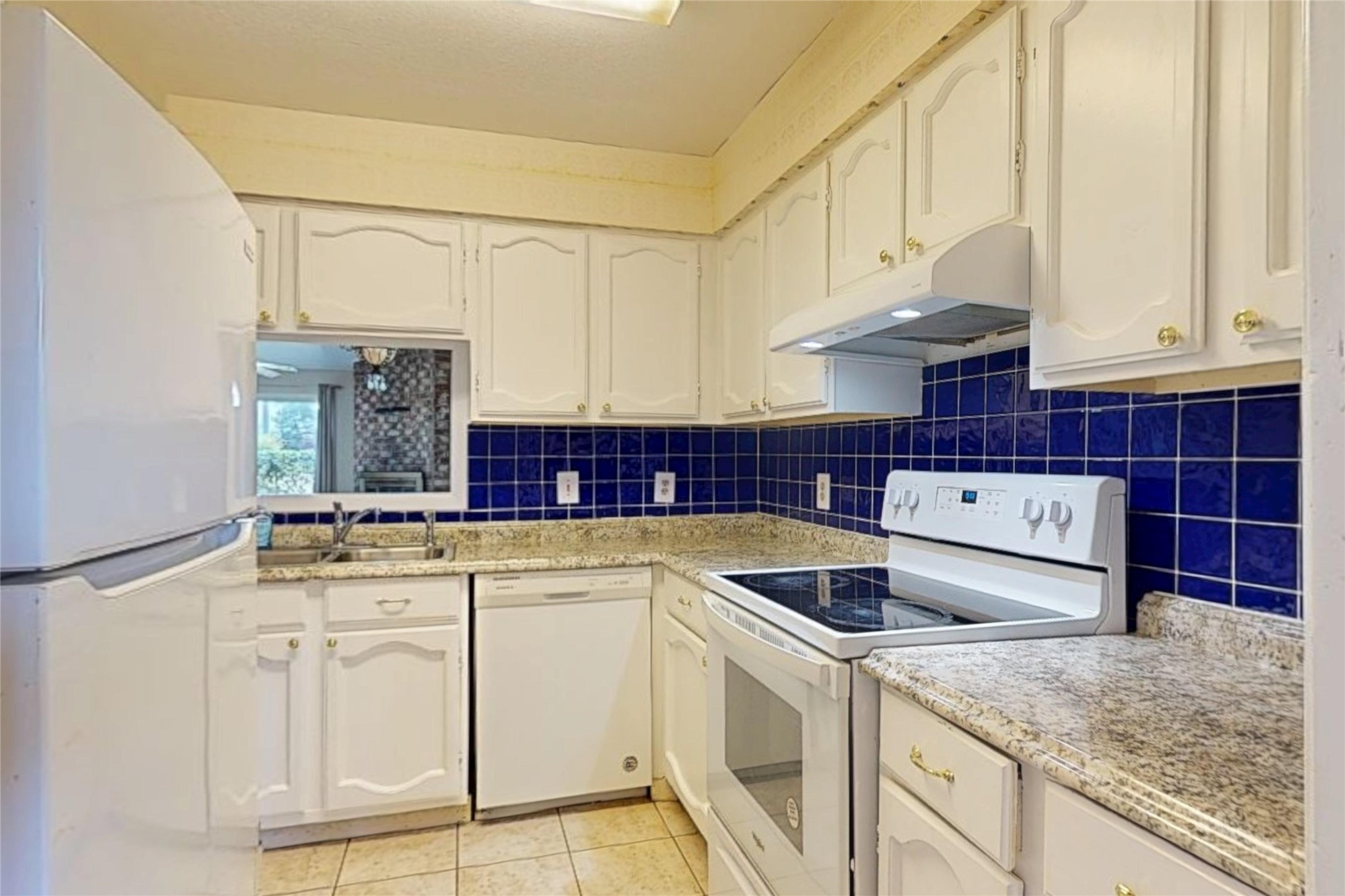 7840 Bateman Lane Houston, TX 77088 - Photo 6 of 25 a kitchen with stainless steel appliances granite countertop a sink and cabinets