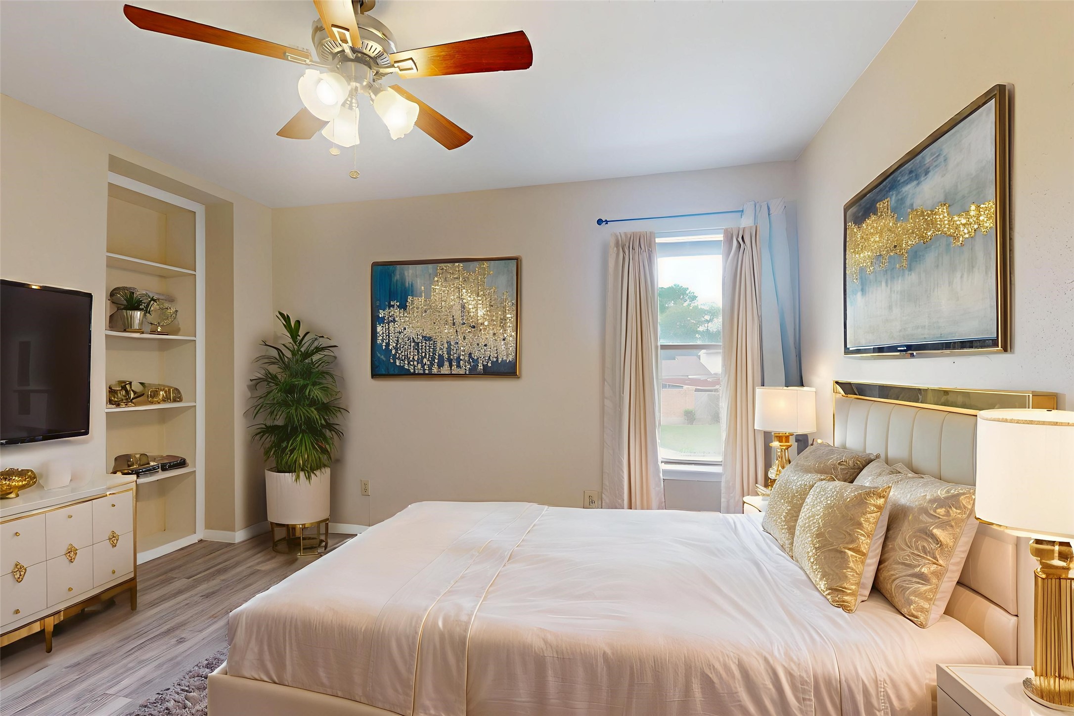 7840 Bateman Lane Houston, TX 77088 - Photo 8 of 25 a bedroom with a bed and a flat screen tv