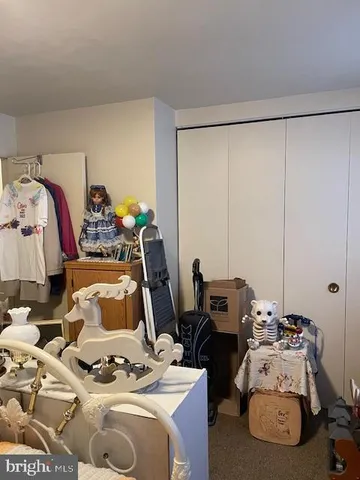 a bedroom with bed and a window