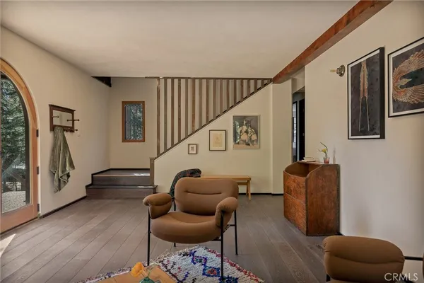 a spacious bedroom with a bed and a window
