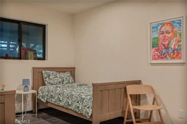 a bedroom with a bed and a walk in closet