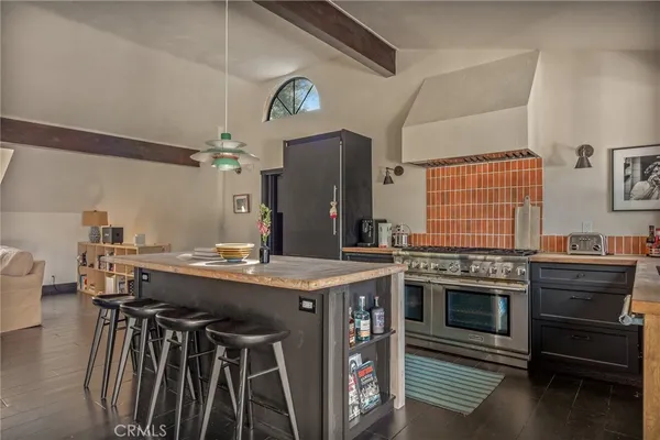 a kitchen with stainless steel appliances granite countertop a stove and a sink