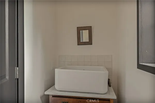 a dining room with furniture and windows