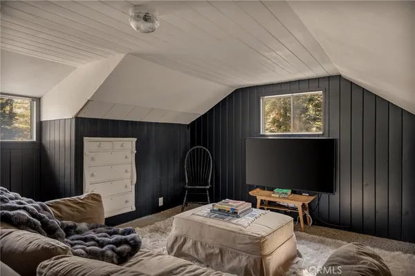 a bedroom with bed and a window
