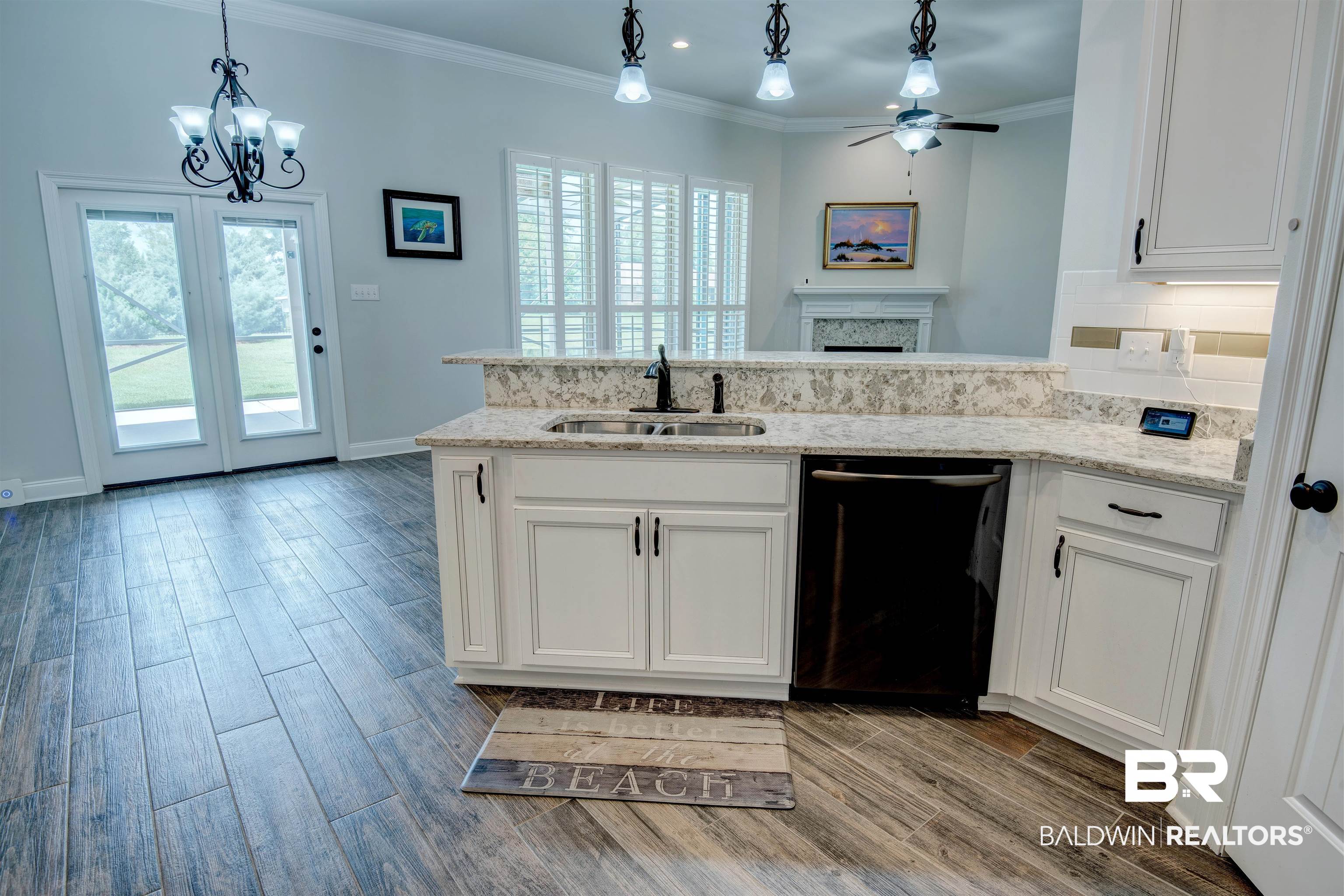 9843 Chipper Lane Foley, AL 36535 - Photo 11 of 34 Kitchen featuring black dishwasher, a sink, ceiling fan, healthy amount of natural light, and crown molding