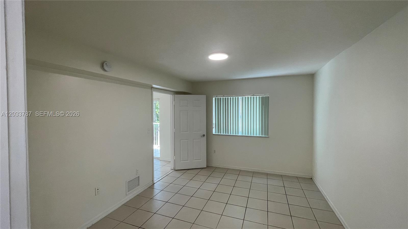 2475 Northwest 16th St Road, Unit 309 Miami, FL 33125 - Photo 13 of 16 Second Bedroom