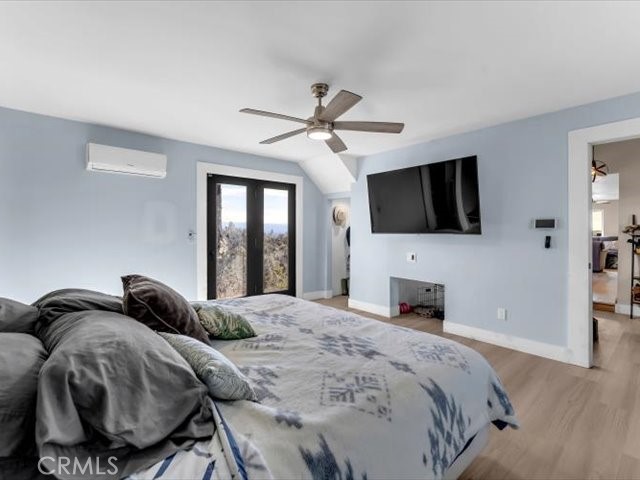 14091 Highview Trail Redding, CA 96003 - Photo 14 of 61 a bedroom with a bed and a flat screen tv