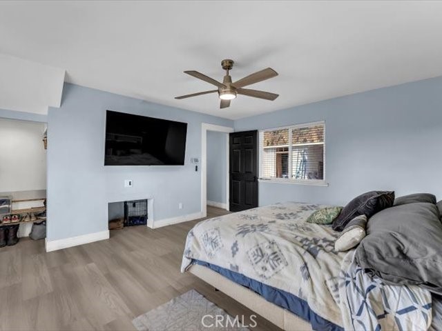 14091 Highview Trail Redding, CA 96003 - Photo 16 of 61 a bedroom with a bed and a flat screen tv