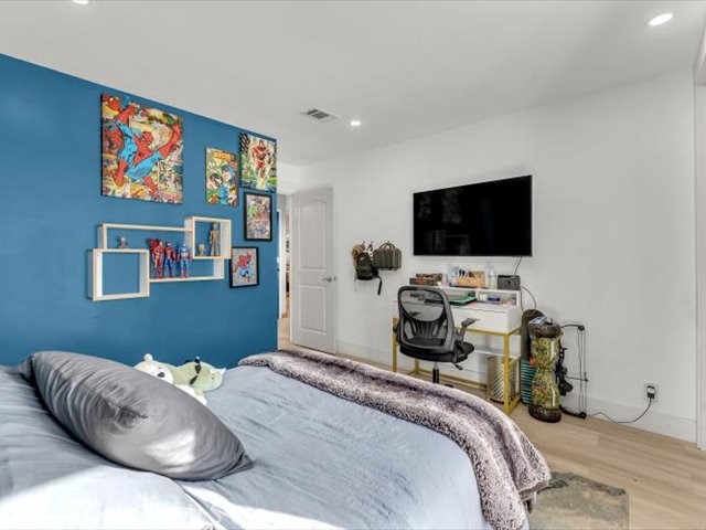 14091 Highview Trail Redding, CA 96003 - Photo 22 of 61 a bedroom with bed and a flat screen tv