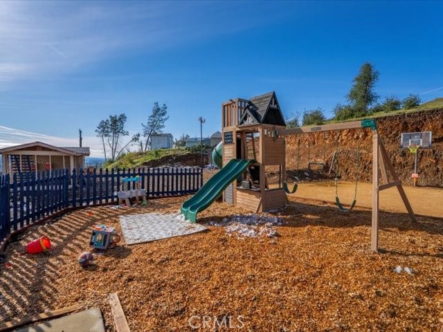 14091 Highview Trail Redding, CA 96003 - Photo 52 of 61 a view of a house with a wooden deck
