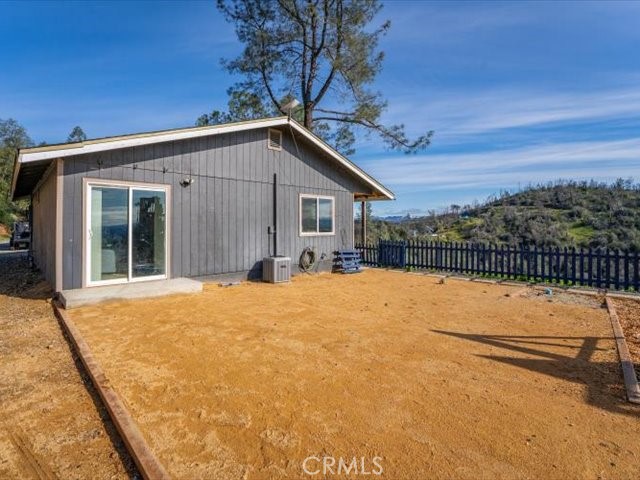 14091 Highview Trail Redding, CA 96003 - Photo 53 of 61 a backyard of a house with table and chairs