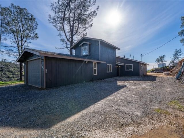 14091 Highview Trail Redding, CA 96003 - Photo 59 of 61 a view of a house with a yard and garage