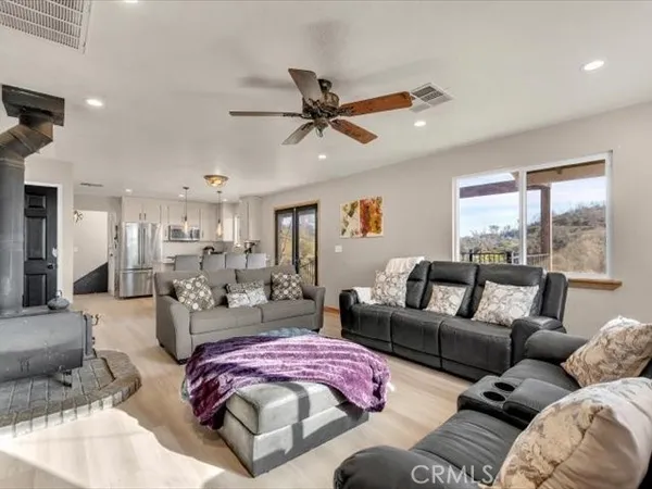 a kitchen with stainless steel appliances white cabinets and a refrigerator