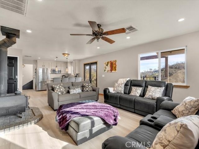 14091 Highview Trail Redding, CA 96003 - Photo 6 of 61 a living room with furniture and a large window