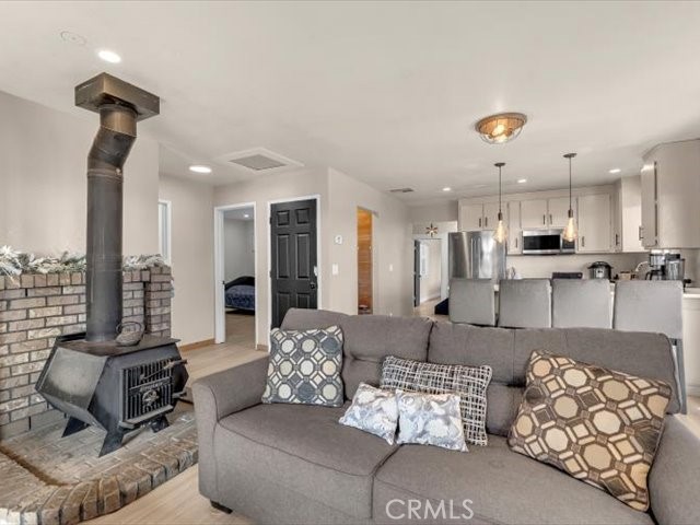 14091 Highview Trail Redding, CA 96003 - Photo 7 of 61 a living room with furniture kitchen view and a chandelier