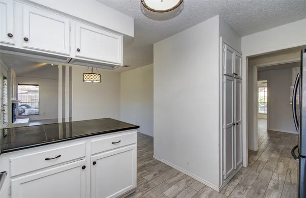 a view of a storage and utility room with closet