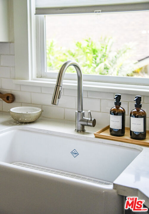 2124 Ridgeview Avenue Los Angeles, CA 90041 - Photo 11 of 33 a kitchen sink with a granite countertop
