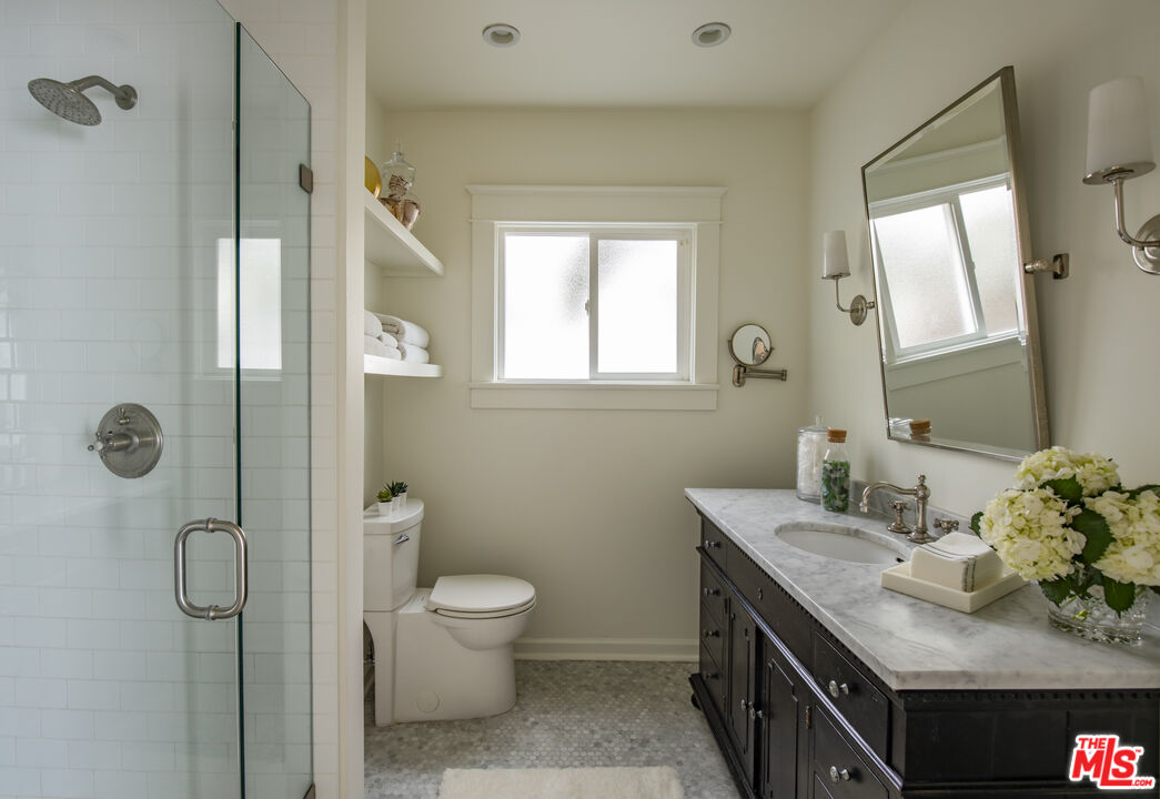 2124 Ridgeview Avenue Los Angeles, CA 90041 - Photo 17 of 33 a bathroom with a granite countertop sink toilet and shower