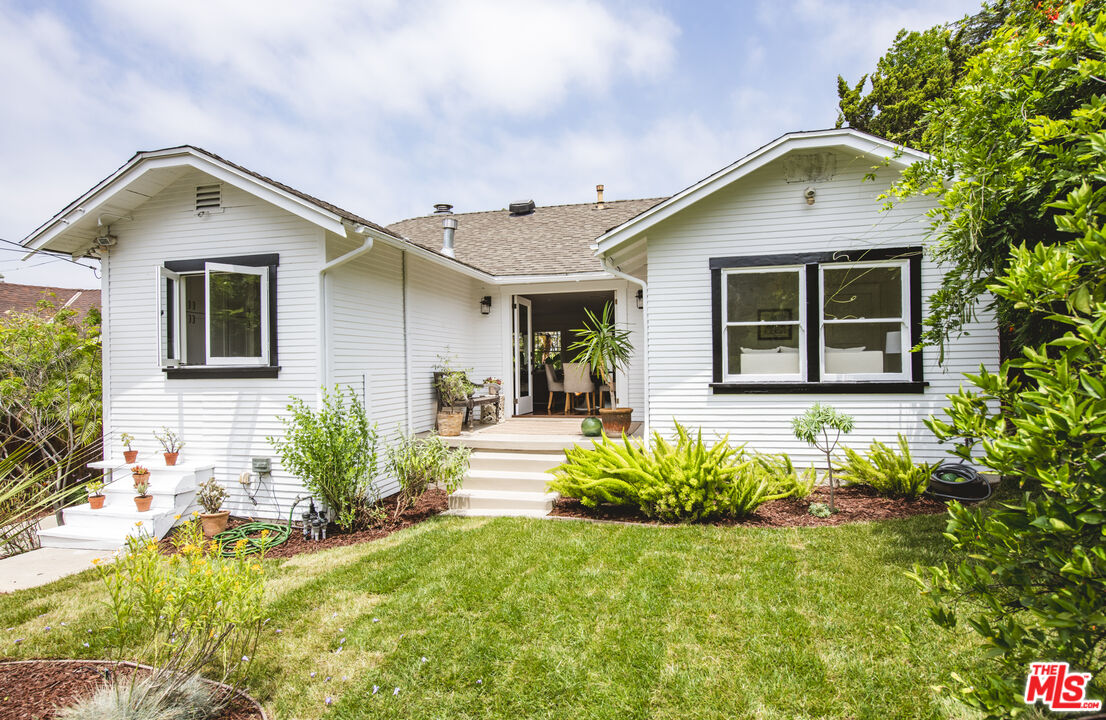 2124 Ridgeview Avenue Los Angeles, CA 90041 - Photo 22 of 33 a front view of a house with a yard
