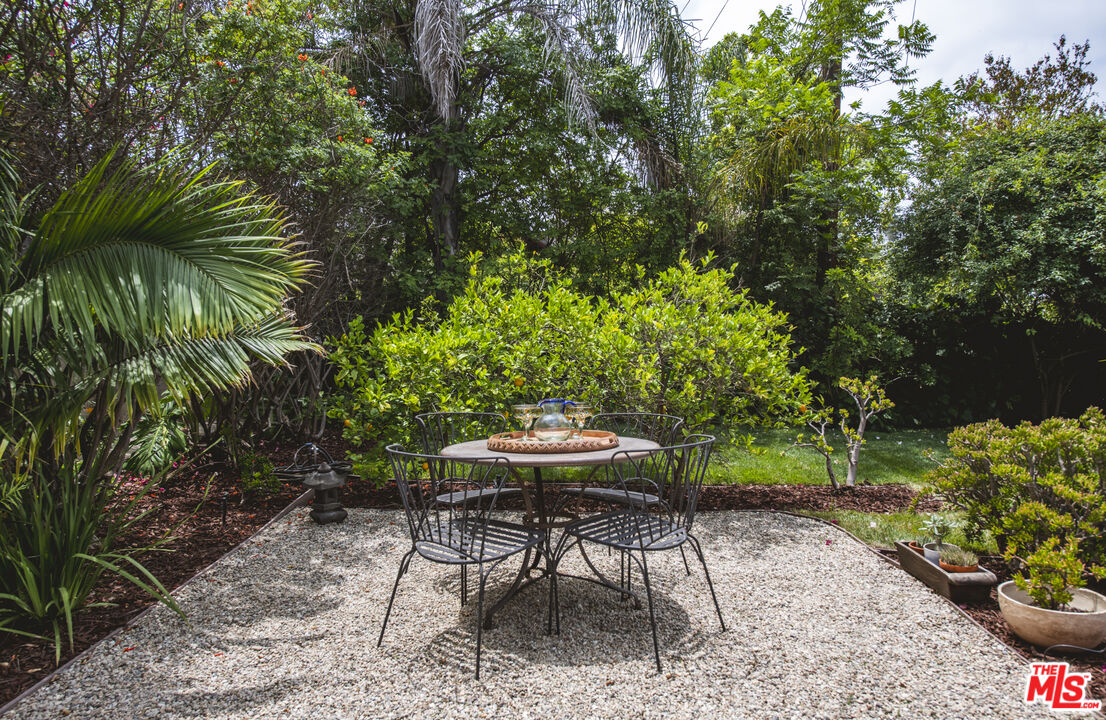 2124 Ridgeview Avenue Los Angeles, CA 90041 - Photo 25 of 33 a view of a table and chairs in backyard